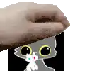 a cartoon cat with big eyes is being held by a person .