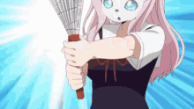 a pink haired anime girl is holding a broom in her hands