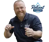 a man wearing a shirt that says reliant plumbing on it