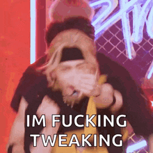a person covering their mouth with their hand and the words im fucking tweaking