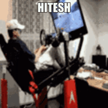 a man is playing a video game with the name hitesh on the bottom