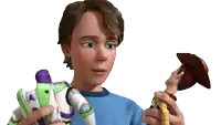 a boy in a blue shirt is holding a toy that looks like buzz lightyear