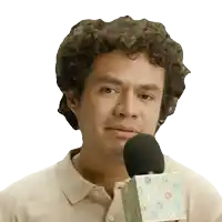 a man with curly hair is holding a microphone with the letter d on the top