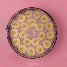 a person is using a spoon to spread ice cream in a pan that says easy plus on the bottom