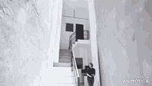 a woman is standing on a set of stairs that are made in animotica