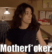 a woman in a black shirt says motherf*cker