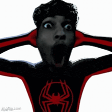 a man in a black and red spider man costume is screaming