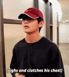 Taehyung Clutches Chest GIF