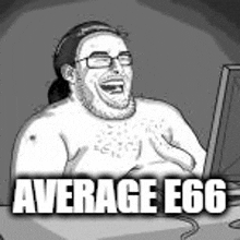 a man is laughing while looking at a computer screen .