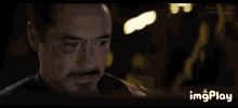 a close up of a man 's face with the words imgplay visible