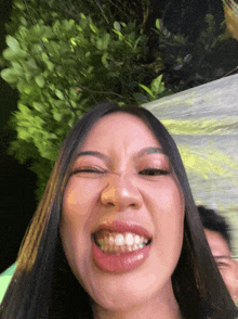 a woman is making a funny face with her mouth open