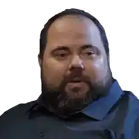 a man with a beard wearing a blue shirt
