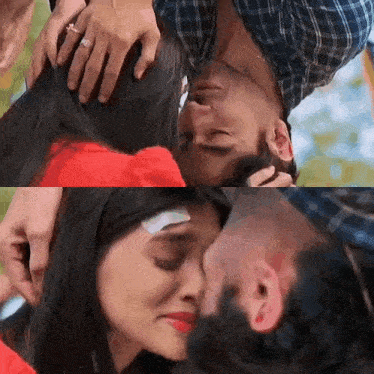 a man is holding a woman 's head and kissing her .