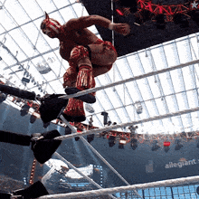 a wrestling ring with the word allegiance in the corner