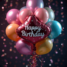 a bunch of colorful balloons with a red balloon that says happy birthday