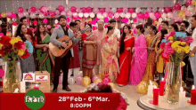 a group of people standing in front of balloons and candles with the date 28th feb - 6th mar 8:00 pm