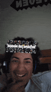 a man wearing headphones has a banner on his head that says random r6s operator
