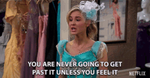 a woman in a blue dress says you are never going to get past it unless you feel it netflix
