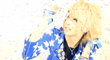 a person wearing a blue and white jacket with stars