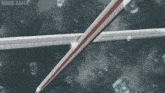 a close up of a girl with blue hair and the words ndds sama on the bottom right