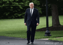 a man in a suit and tie is walking down a street