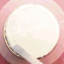 a chocolate cake with white frosting drips down the sides