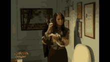 a woman in a room with a sign that says " manana siempre "
