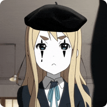a blonde anime girl wearing a black beret and a joker face