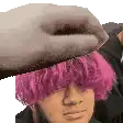 a man with pink hair is being slapped by a hand .