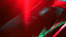 a close up of a red blue and green colored fabric