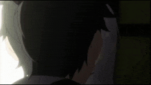 a man and a girl are standing next to each other in a dark room .
