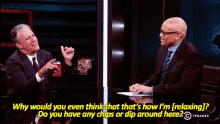 two men are sitting at a table and one of them is asking the other why would you
