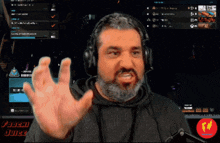 a man with a beard wearing headphones and a sign that says fooseh juice