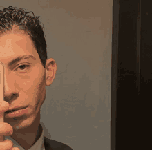 a man is taking a selfie with his phone