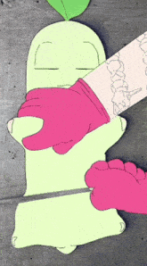a drawing of a person holding a green cartoon character