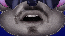 a close up of a person 's mouth with a beard