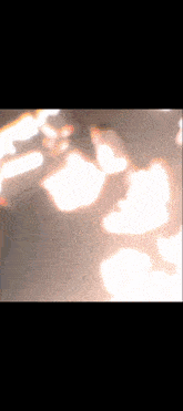 a shadow of a person is cast on the floor
