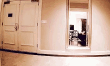 a hallway with a mirror and a door that says ' ii ' on it