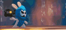 a cartoon rabbit wearing a blue cape with a skull on it