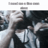 a man is taking a picture with a camera with the caption i need me a fine man slaw .