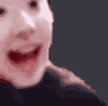 a close up of a person 's face with a surprised look on their face
