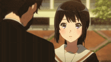 a man and a girl are looking at each other