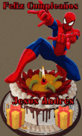 a birthday cake with a spiderman on top and the words feliz cumpleanos written on it