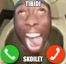 a man is sitting in a toilet talking on a cell phone with two green buttons .