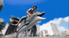 a man is riding on the back of a dolphin in front of a city