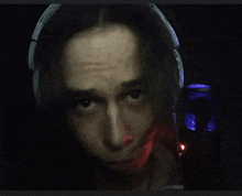 a close up of a person wearing headphones and a microphone