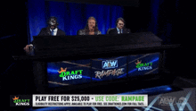 a group of people sitting at a table with a sign that says draft kings rampage