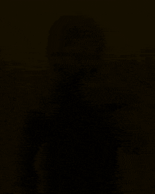 a blurred image of a man with a beard and a red and yellow stripe that says ' i '