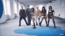 a group of people are dancing in a room with the words rbd.gif on the bottom right