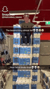 a boy wearing a crown is sitting in a chair made out of toilet paper rolls